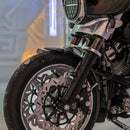 Close-up of motorcycle front wheel with custom disc brake rotor and fork