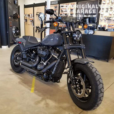 Harley-Davidson Softail Fat Bob LED headlight conversion kit installed on gray motorcycle