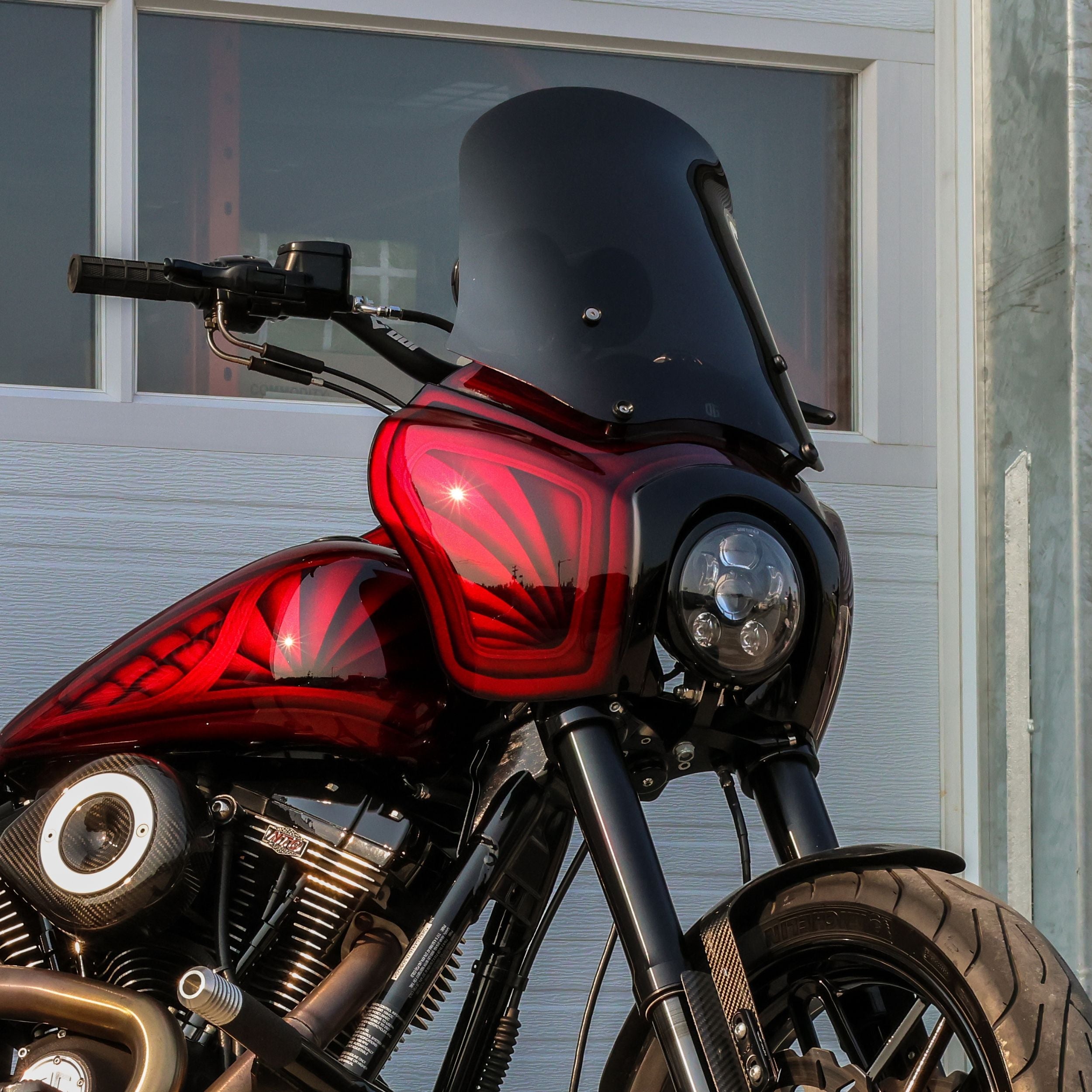 Red batwing sport fairing with smoked windshield for Harley‑Davidson motorcycle