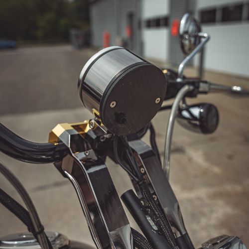 OG single gauge pod mounted on chrome motorcycle handlebars