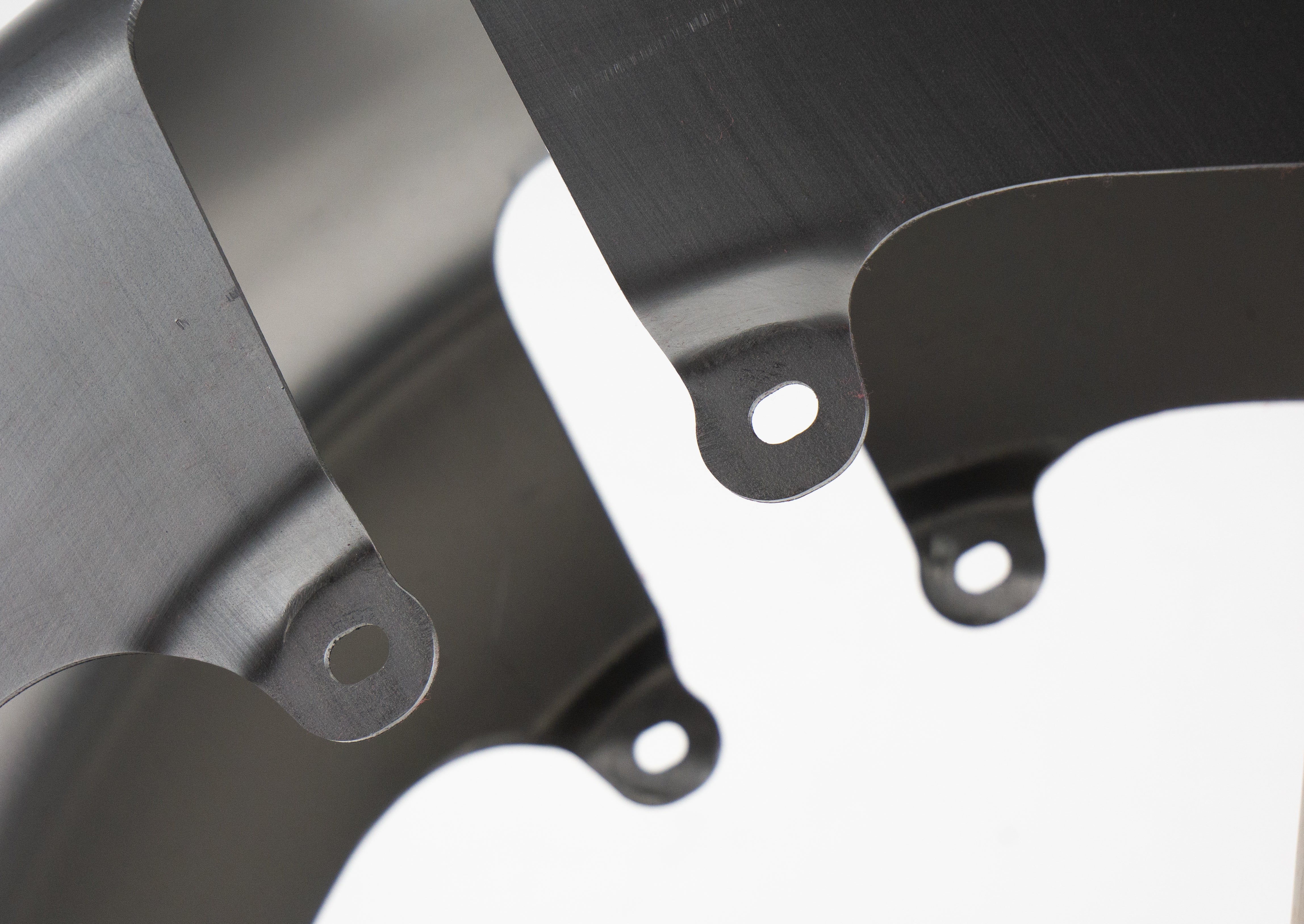 RWD V-Twin 8-inch wide LS-2 front fender raw steel close-up showing mounting tabs