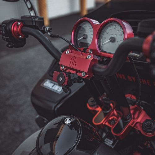 Red anodized Harley Road Glide gauge bezel and handlebar clamp