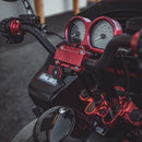 Red anodized Harley Road Glide gauge bezel and handlebar clamp