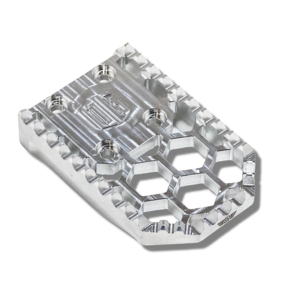 CNC silver aluminum motorcycle footpeg with hex honeycomb cutouts and serrated grip