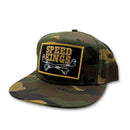 Camouflage baseball cap with 'Speed Kings' patch on a white background