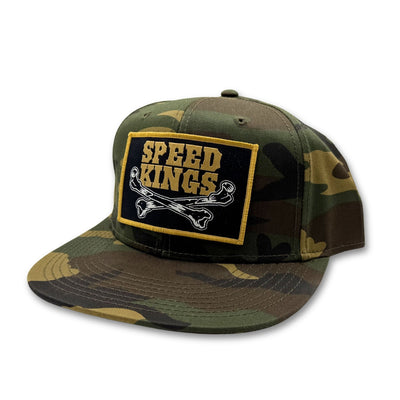 Camouflage baseball cap with 'Speed Kings' patch on a white background