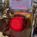 Red LED laydown integrated Dyna tail light on a motorcycle with 'Harley-Davidson' branding.