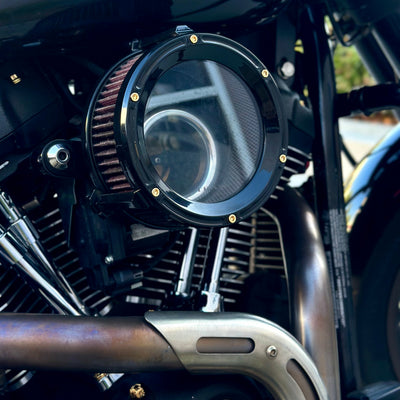 Trask air cleaner bolt kit on Harley-Davidson with six BAMCO ARP stainless-steel gold bolts on black cover