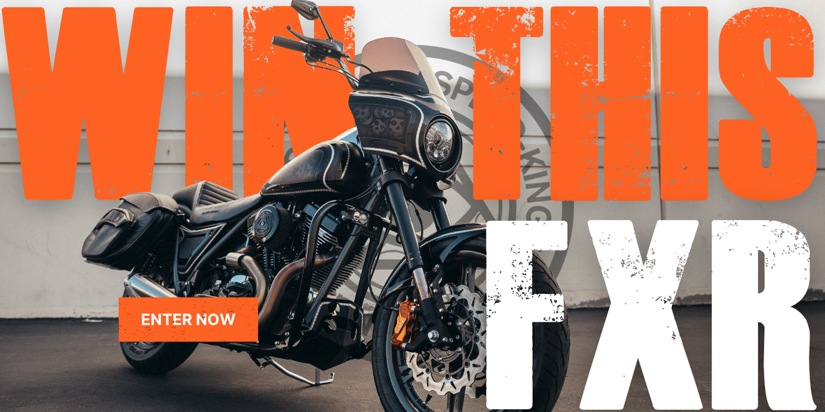 A custom painted Harley Davidson FXR motorcycle is shown in a garage-like setting with large orange and white text reading 'WIN THIS FXR' and an 'ENTER NOW' button overlay.