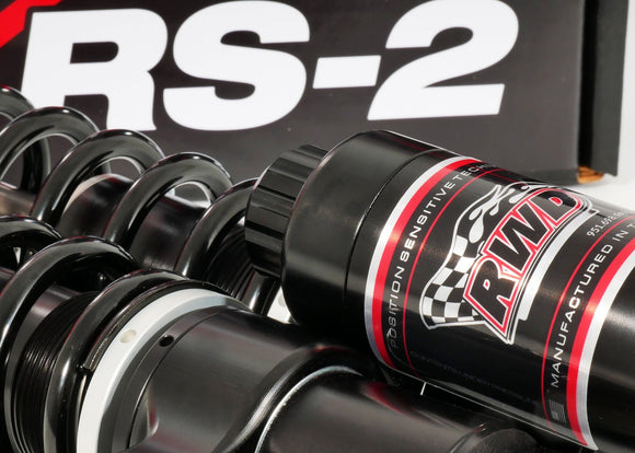 RWD V-Twin RS-2 touring motorcycle shock absorber close-up showing coil spring and external reservoir