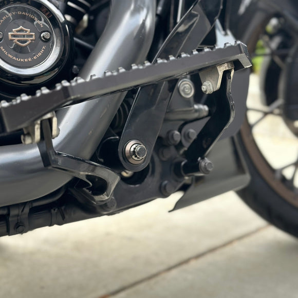 Close-up of BAMCO ARP stainless bolts installed on a Harley-Davidson Bagger, Bagger Brake Arm ARP Nut Kit