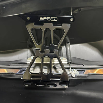Speed by Design Billet Saddlebag Lid Tethers for Harley Davidson Touring Motorcycles in Black installed on a street glide