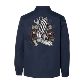 Navy blue jacket with american traditional tattoo inspired Praying Hands design on the back featuring a hand holding a wrench and the text 'Speed Kings' on a white background.