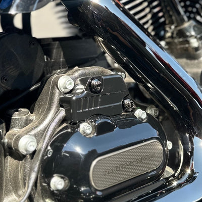 Close-up of the BAMCO Gear Position Sensor Cover - Gloss Black installed on a Harley-Davidson Harley