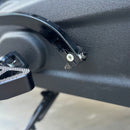 Close-up of BAMCO ARP stainless steel M8 bolt and nut installed on Harley-Davidson Softail shift arm near footpeg